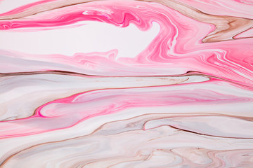 Fluid art texture. Abstract backdrop with mixing paint effect. Liquid acrylic picture with flows and splashes. Mixed paints for website background. Pink, brown and white overflowing colors
