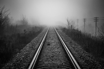 Fototapeta premium Railway track disappear in fog