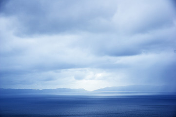 Fototapeta na wymiar Distant Catalina Island With Overcast Sky