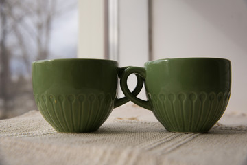 two green tea mugs