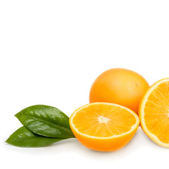 Orange whole and cut into halves with leaves. Isolated on a white background.