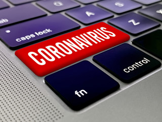Fototapeta premium Coronavirus key on a laptop