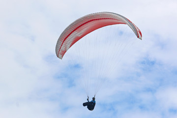 Paraglider flying wing in a blue sky	