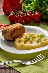 Cutlet in Kiev. Cutlets in breadcrumbs, stuffed with butter and herbs, served with potatoes. Still-life