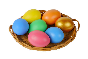 Colorful Easter eggs in the basket on the white background