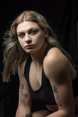 Fototapeta premium Closeup portrait of a sportswoman with blond hair.
