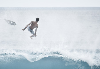 Surfing wipeout in Bali - obrazy, fototapety, plakaty