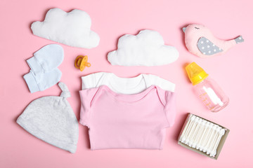 baby clothes on a colored background top view. Baby background