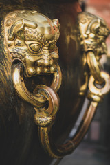 Close-up of a bronze handle of a ancient large bronze water tank, Forbidden City, Beijing China