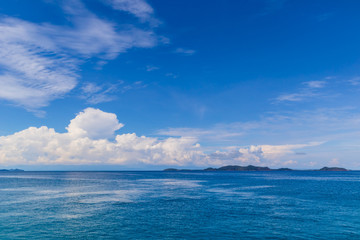 Blue sky with white cloud  and deep blue sea
