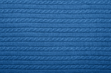 Background texture of blue knitted wool fabric