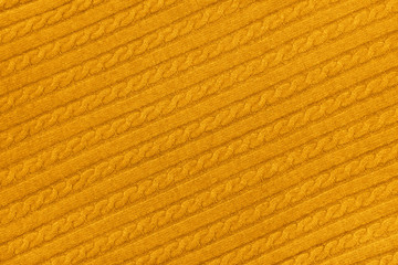 Background texture of yellow knitted wool fabric