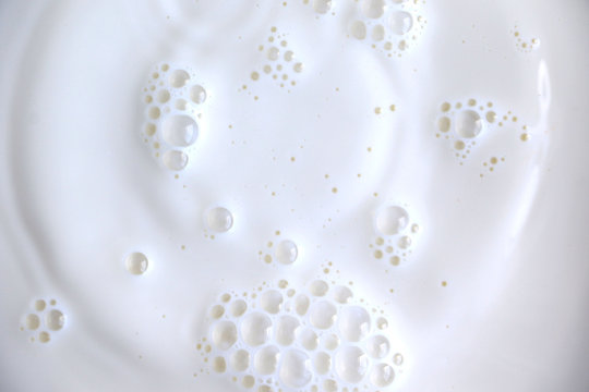 White Surface Of Milk And Bubbles And Ripples From Above Birds Eye View