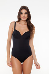 Fototapeta premium beautiful girl posing in stylish detailed black swimsuit on white background.