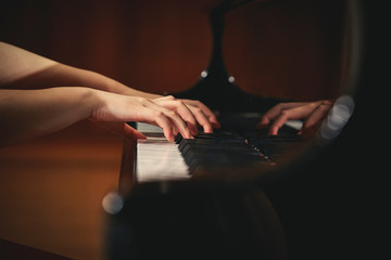 A woman playing the piano