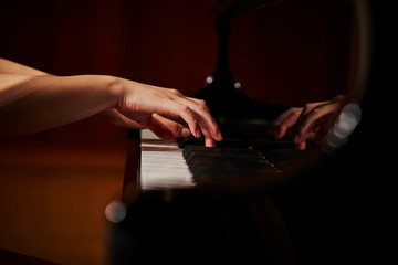 A woman playing the piano