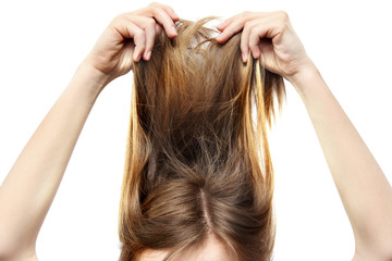 Fototapeta premium The girl raised her hair on a white background