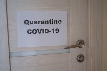 Ad on the door. Quarantined. Coronavirus epidemic. Pandemic of the 21st century. covid-19