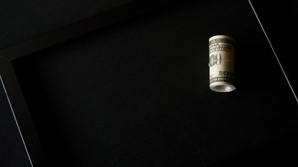 Banknotes on a black background, isolated in black. Money is twisted. Beautiful abstraction on the theme of finance.