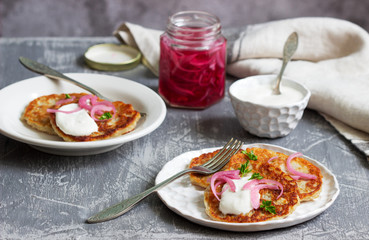 Breakfast made from traditional boxty fritters or latkes served with pickled onions and sour cream.