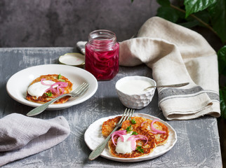 Breakfast made from traditional boxty fritters or latkes served with pickled onions and sour cream.