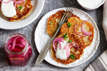Breakfast made from traditional boxty fritters or latkes served with pickled onions and sour cream.