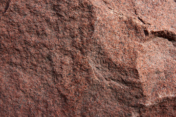 Rough surface of the stone wall with brown tint. Horizontal stone texture for pattern and background.
