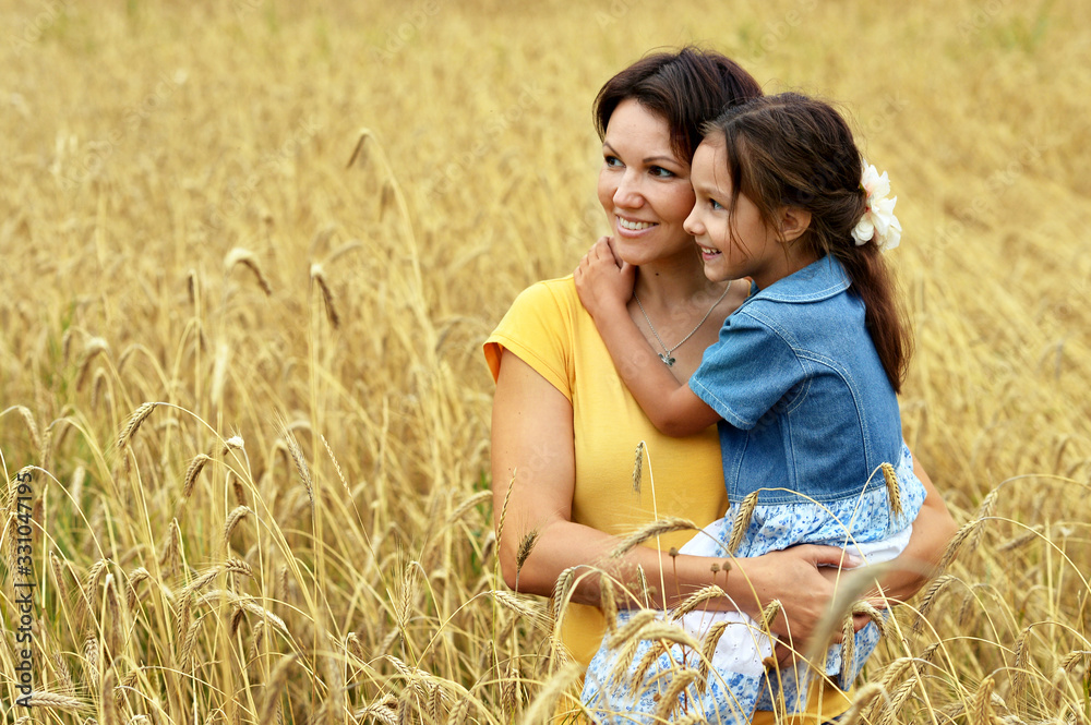 Sticker Happy mother and daughter at summer field