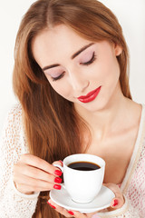 Portrait of Beautiful Woman with cup of Coffee close up