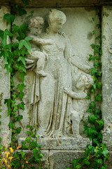 Antique stone statue of Woman with children as symbol of Сharity (Haritas).