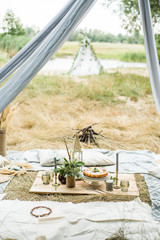 Picnic on the beach at sunset in the style boho, food and drink conception. Healthy, fresh.