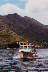 Passenger boat sailing on Boka Kotor Bay of Adriatic Sea