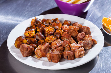 Chopped traditional Colombian dish - chorizo and chicharrón