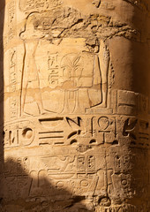 Luxor Governorate, Egypt, Karnak Temple, complex of Amun-Re. Embossed hieroglyphics on columns and walls. Min  is an ancient Egyptian god.
