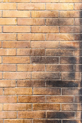 Burnt brick. Wall with rough brickwork.