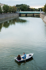 Fototapeta premium The boat floats on the water, a pleasure boat on the river