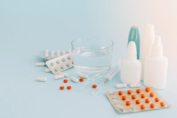 Set of pills and bottles of nose drops for treatment various viruses symptoms. Treatment of...
