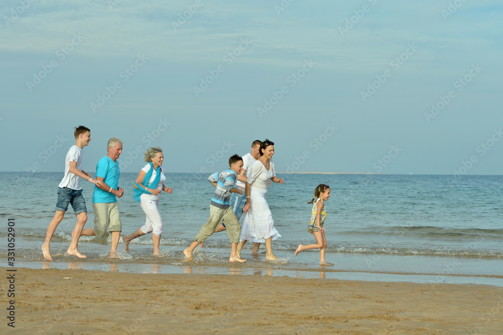 Canvas Prints Portrait of family together on sand beach