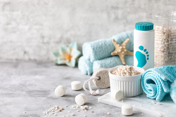 Fototapeta na wymiar Spa accessories - sea salt, brush, powder, effervescent bath tablets, pumice, cream on a light background. Healthy lifestyle concept. Beauty, lifestyle, composition for skin care. 