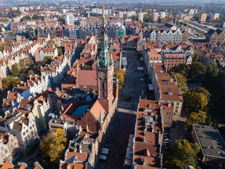 Aerial view of old historical town centre with typical colorful houses buildings, City Hall spire...