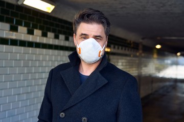 Coronavirus disease - man wearing face mask