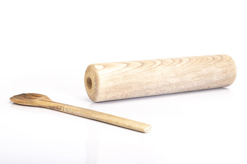 wooden spoon and rolling pin on white background