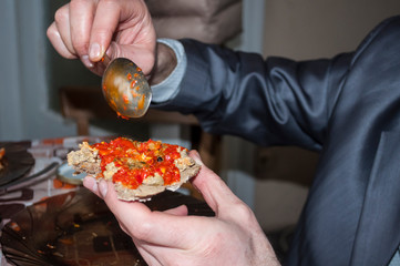 man in a gray jacket having lunch