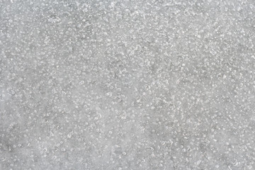 Ice with frozen air bubbles, top view.