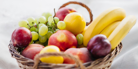 Fresh fruits in a basket, close-up.