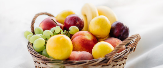 Fresh fruits in a basket, close-up.