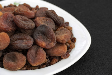 famous turkish dried apricots, sun dried apricots, malatya apricots, dried apricots, dried apricots on the plate,
