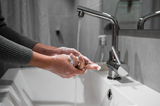 Health care hygiene prevention protection against virus, bacteria, flu and coronavirus, covid-19 disease by washing hands with soap