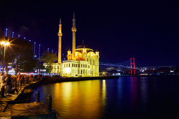 Fototapeta na wymiar Ortakoy Mosque and Bosphorus Bridge (15th July Martyrs Bridge) night view. Istanbul, Turkey