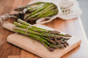 Bunch of fresh asparagus on wooden table